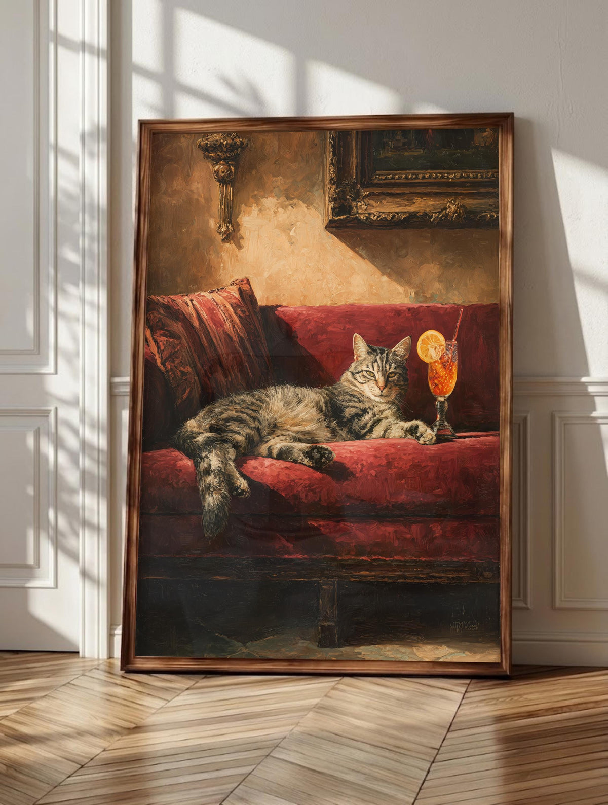 Spritz wall art: a gray tabby stretched across crimson velvet beside a glowing spritz, framed canvas