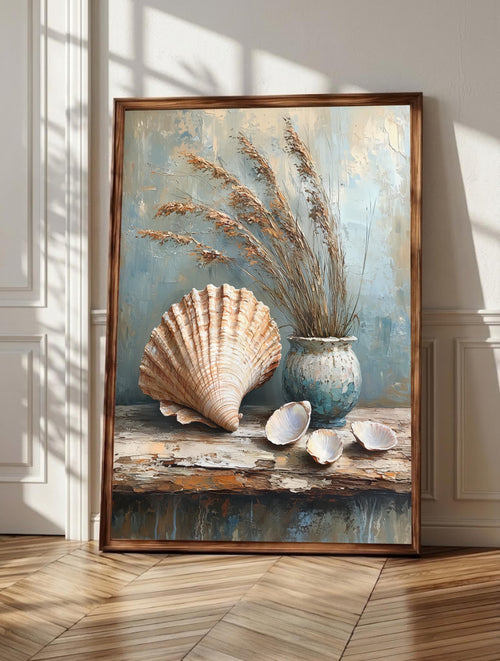 Seashell wall art: shells, sea glass and driftwood arranged in a quiet shore still life