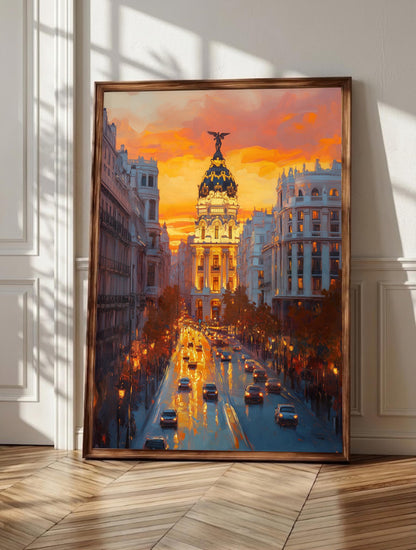 Madrid wall art: the Metropolis Building catching amber light above Gran Via